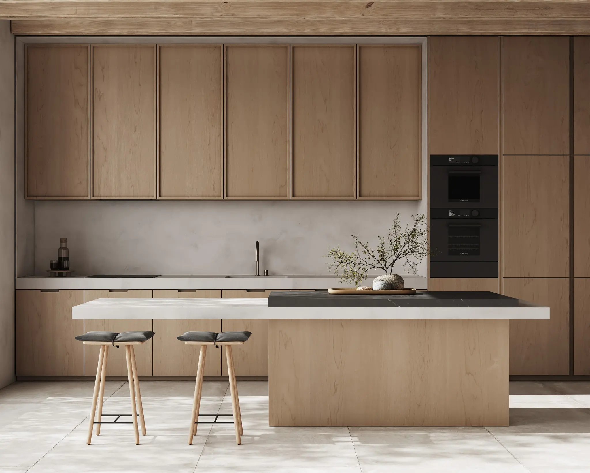 Modern kitchen with natural wood cabinetry, a white and black island, bar stools, and subtle decor, illuminated by soft natural light.